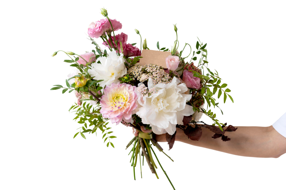 Hand met bloemen voor bezorging in Assen